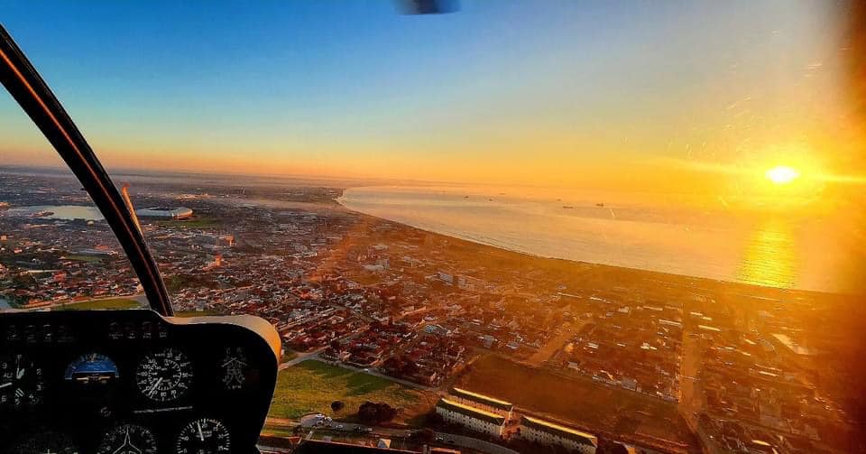 Aerial sunset view from helicopter cockpit over Port Elizabeth